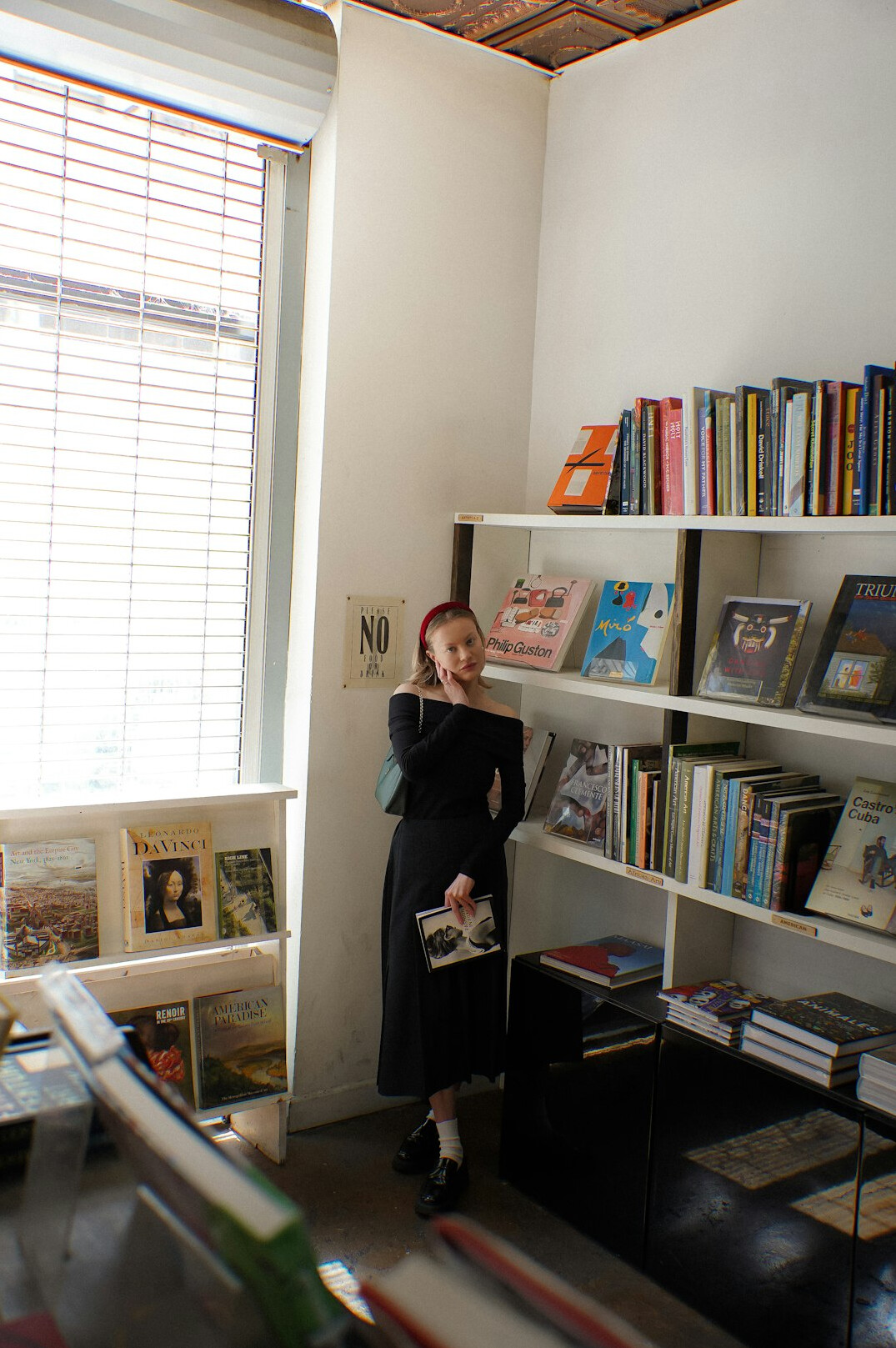 Tall library shelves filled with old books