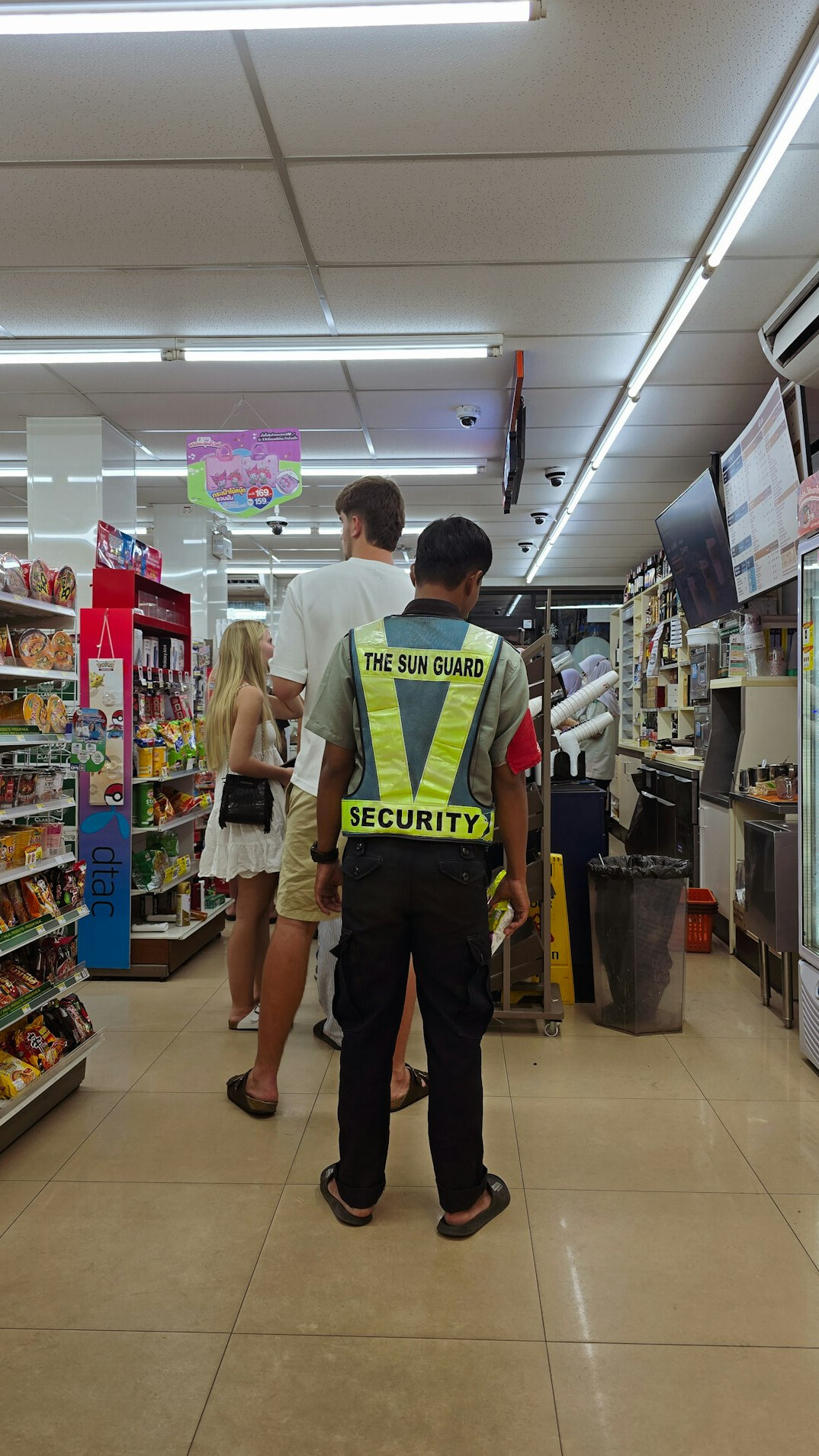 store detective watching customers