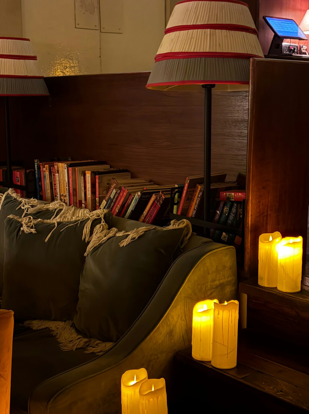 Cozy reading corner with a book and warm lamp