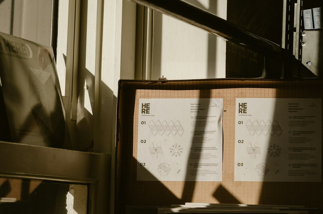 Archival documents and a pen on a desk