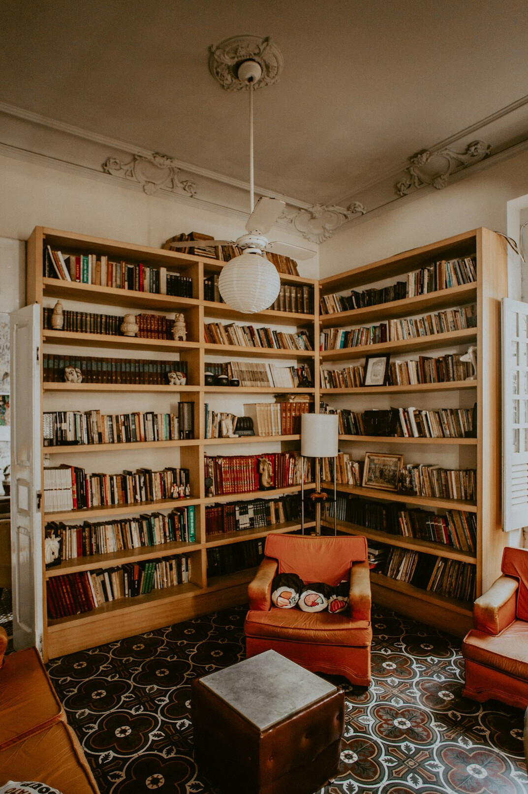 Reading room of a historic library with long shelves