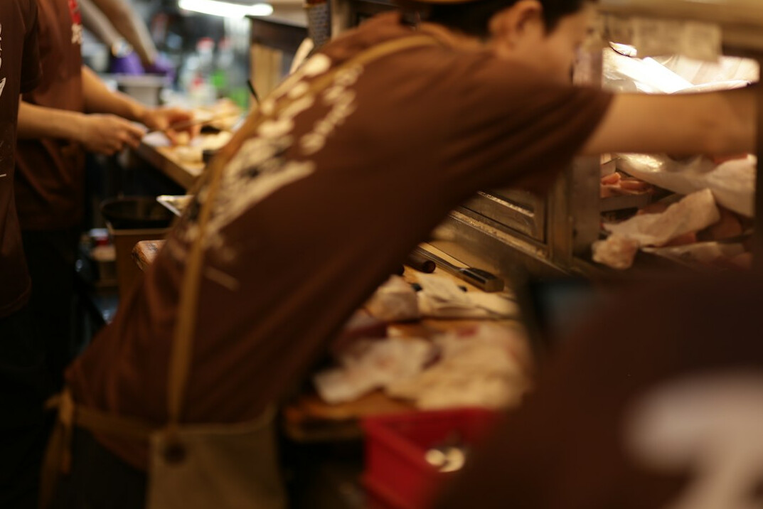 man paying at supermarket till